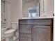 Bathroom with single vanity and tub-shower combo at 1891 Primrose Park Rd, Sugar Hill, GA 30518