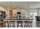 Modern kitchen with stainless steel appliances, granite countertops, and ample cabinet space at 1891 Primrose Park Rd, Sugar Hill, GA 30518