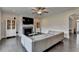 Living room boasts fireplace, hardwood floors, and view to entry at 1891 Primrose Park Rd, Sugar Hill, GA 30518
