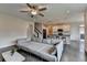 Open floor plan living room view to kitchen and staircase at 1891 Primrose Park Rd, Sugar Hill, GA 30518