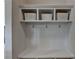 Mudroom featuring built-in storage cubbies, hooks, and bench, providing an organized space at 1891 Primrose Park Rd, Sugar Hill, GA 30518