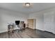 Office with a desk, shelves and hardwood floors, complemented by natural light at 1891 Primrose Park Rd, Sugar Hill, GA 30518