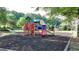 Vibrant community playground with colorful equipment and a soft surface for safe and enjoyable play at 1891 Primrose Park Rd, Sugar Hill, GA 30518