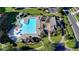 Aerial shot showcasing the community pool and clubhouse with ample seating and mature landscaping at 1891 Primrose Park Rd, Sugar Hill, GA 30518