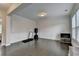 Versatile room with dark wood floors, crown molding, wainscoting, and bright natural light at 1891 Primrose Park Rd, Sugar Hill, GA 30518