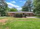 The backyard features a brick house, green lawn and plenty of room for outdoor activities at 20 Shadow Creek Dr, Villa Rica, GA 30180