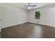 Bright bedroom with hardwood flooring, ceiling fan, and large window at 20 Shadow Creek Dr, Villa Rica, GA 30180