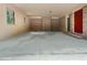 Carport with brick walls, wooden trim, and red front door at 20 Shadow Creek Dr, Villa Rica, GA 30180