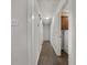 Hallway showing new floors connecting rooms, featuring access to the laundry room at 20 Shadow Creek Dr, Villa Rica, GA 30180