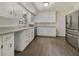 The kitchen offers white cabinets, stainless steel appliances, and granite countertops at 20 Shadow Creek Dr, Villa Rica, GA 30180