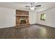 The living room features a striking brick fireplace and ample natural light from the window at 20 Shadow Creek Dr, Villa Rica, GA 30180