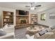 Bright living room with a brick fireplace, ceiling fan and stylish decor at 20 Shadow Creek Dr, Villa Rica, GA 30180