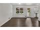 Bright living room featuring new hardwood floors, a window, and access to the kitchen at 20 Shadow Creek Dr, Villa Rica, GA 30180