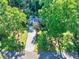 Aerial shot of the home, showcasing the roof, long driveway, and surrounding greenery at 2648 Oswood Dr, Tucker, GA 30084