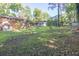 Large backyard features mature trees and green grass at 2648 Oswood Dr, Tucker, GA 30084