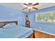 Comfortable bedroom with hardwood floors, ceiling fan and natural light at 2648 Oswood Dr, Tucker, GA 30084