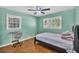 Inviting bedroom featuring hardwood floors, natural light and study area at 2648 Oswood Dr, Tucker, GA 30084
