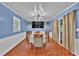 Cozy dining room with hardwood floors, a chandelier, and sliding doors to the backyard at 2648 Oswood Dr, Tucker, GA 30084
