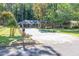 Brick house with a long driveway and rose bushes in the front yard at 2648 Oswood Dr, Tucker, GA 30084