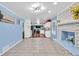 Spacious living area with a brick fireplace and an open layout connecting to the kitchen and dining area at 2648 Oswood Dr, Tucker, GA 30084