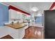 Bright kitchen with white cabinets, stainless steel appliances, and a view into the Gathering room at 2648 Oswood Dr, Tucker, GA 30084