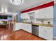 Well-lit kitchen featuring white cabinets, butcher block countertops, and stainless steel appliances at 2648 Oswood Dr, Tucker, GA 30084