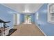 Spacious bonus room featuring carpet, wainscoting and natural light at 2648 Oswood Dr, Tucker, GA 30084