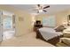 Sunny bedroom with neutral walls, an en-suite bathroom, and a comfortable bed at 312 Crabapple Springs Way, Woodstock, GA 30188
