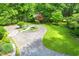 Circular driveway with beautifully landscaped central island and verdant lawn at 312 Crabapple Springs Way, Woodstock, GA 30188