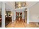 Grand foyer boasts hardwood floors, soaring ceilings, and an elegant chandelier at 312 Crabapple Springs Way, Woodstock, GA 30188