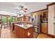 Spacious kitchen featuring an island, stainless steel appliances, and ample cabinet space at 312 Crabapple Springs Way, Woodstock, GA 30188