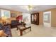 Comfortable living room with patterned sofas, a glass coffee table, and neutral carpet at 312 Crabapple Springs Way, Woodstock, GA 30188