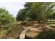 Serene view of a common area, featuring sidewalks, greenery, trees, and well-maintained landscaping at 4875 Carre Way, Alpharetta, GA 30022