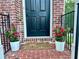 Welcoming front door with flowerpots and a 'hope you brought wine' doormat at 4875 Carre Way, Alpharetta, GA 30022