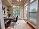 Functional home office with a desk, chair, and natural light from a large window and balcony access at 4875 Carre Way, Alpharetta, GA 30022
