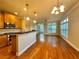 Modern kitchen with granite countertops, stainless steel appliances, and hardwood floors at 4875 Carre Way, Alpharetta, GA 30022