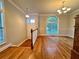 Open-concept living room featuring hardwood floors, natural light, and modern decor at 4875 Carre Way, Alpharetta, GA 30022