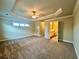 Bright main bedroom with ensuite bath and walk-in closet and features neutral walls and carpet at 4875 Carre Way, Alpharetta, GA 30022