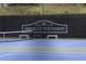 Community tennis court with Abberley Township logo on the screen; recreation and fitness amenity at 4875 Carre Way, Alpharetta, GA 30022