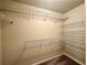 Walk-in closet with multiple shelves and carpeted floor; organized storage solution at 4875 Carre Way, Alpharetta, GA 30022