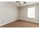 Bedroom with carpet flooring, neutral paint, and ceiling fan at 112 Hawkeye Ln, Conyers, GA 30012