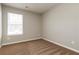 Neutral painted bedroom with carpet and natural lighting from the window at 112 Hawkeye Ln, Conyers, GA 30012
