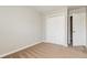 Neutral painted bedroom with carpet and white trim, closet, and doors at 112 Hawkeye Ln, Conyers, GA 30012