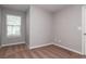 Neutral painted bedroom with carpet and natural lighting from the window at 112 Hawkeye Ln, Conyers, GA 30012