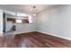 Dining area featuring hardwood floors with a view of the open kitchen, perfect for entertaining at 112 Hawkeye Ln, Conyers, GA 30012