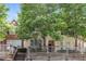 Inviting two-story townhome featuring mature trees and a charming wood porch and facade at 112 Hawkeye Ln, Conyers, GA 30012