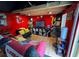 This bonus room features red walls, Kansas City Chiefs decor, and a collection of records and movies at 2671 Club Forest Se Ct, Conyers, GA 30013