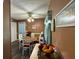 Cozy dining area with seating, charming ceiling fan, and natural light at 2671 Club Forest Se Ct, Conyers, GA 30013