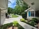 Well-maintained exterior with beautiful landscaping and attached garage at 2671 Club Forest Se Ct, Conyers, GA 30013