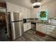Bright kitchen featuring stainless steel appliances, ample cabinet space, and modern flooring at 2671 Club Forest Se Ct, Conyers, GA 30013